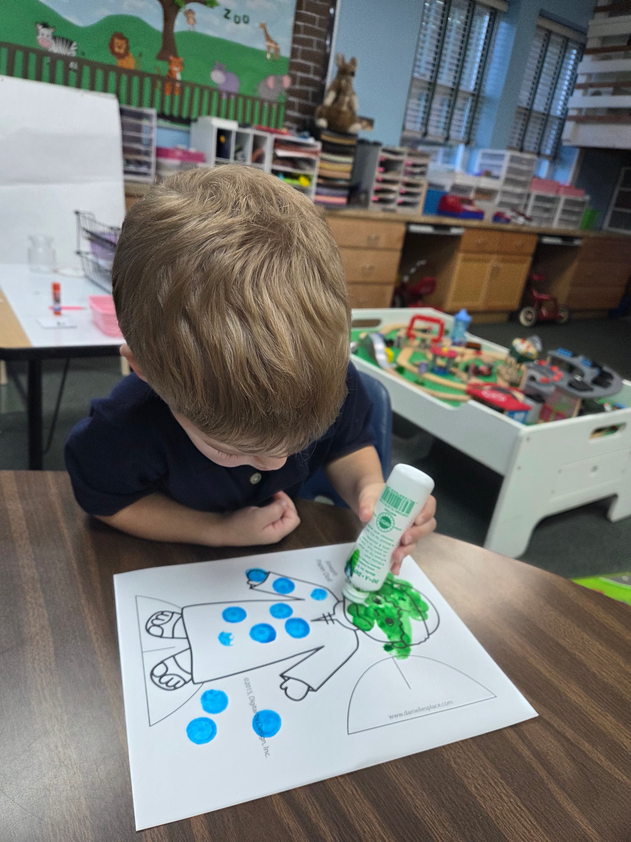 Child doing a creative dot art activity