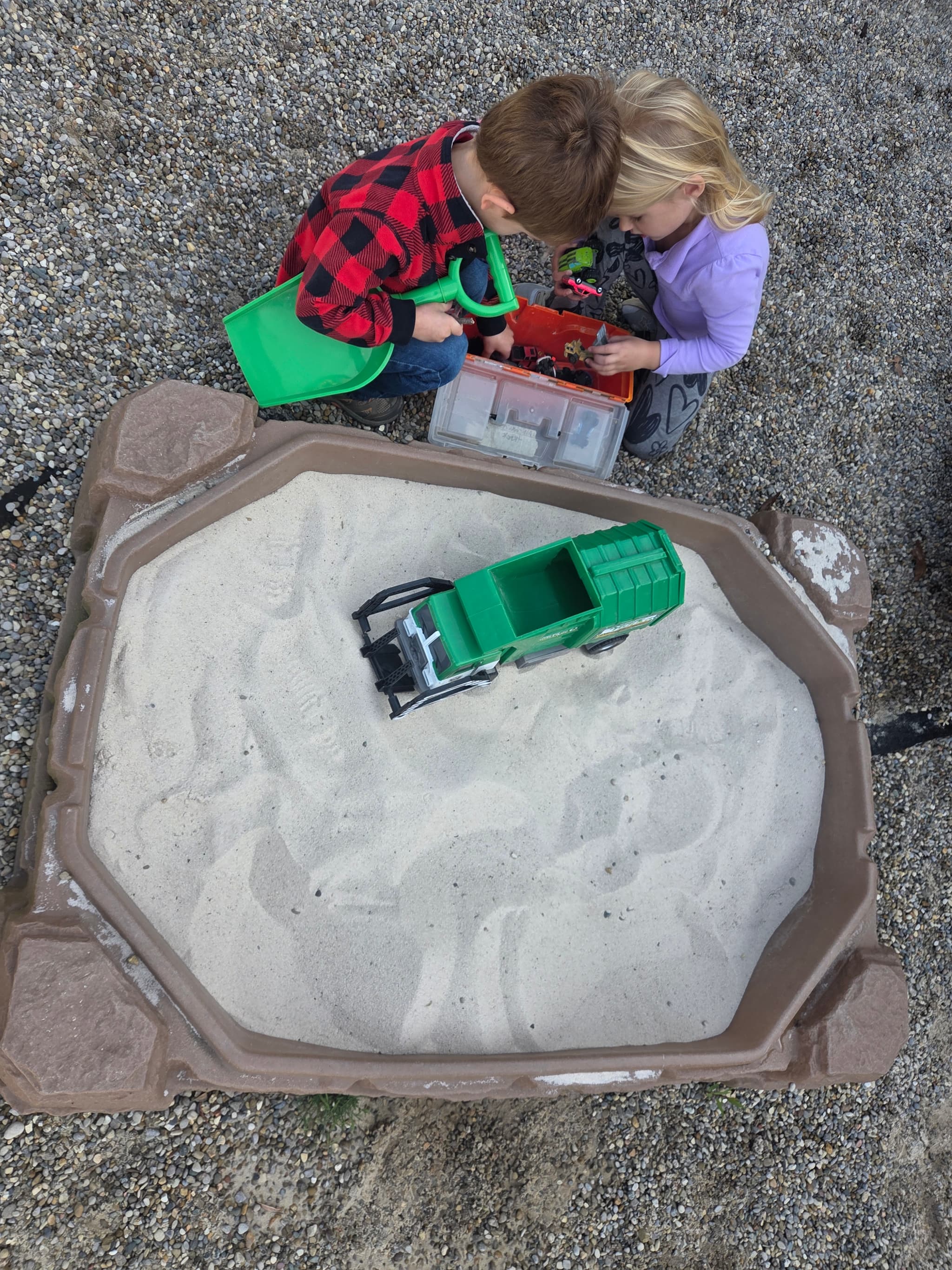 Children playing together in the sandbox